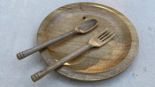 Kevin Lee's turned wooden platter with a matching wooden spoon and fork from Bay Laurel wood.