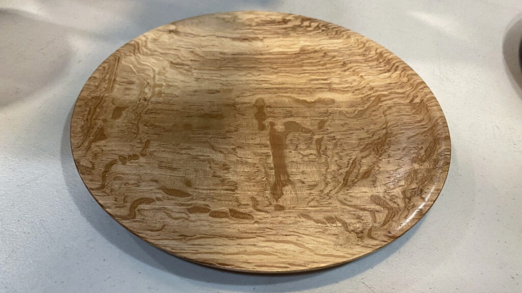 Polished quarter-sawn Coastal Live Oak platter by Kevin Lee with intricate swirling grain, displayed at a West Bay Woodturners meeting in Los Altos, CA.