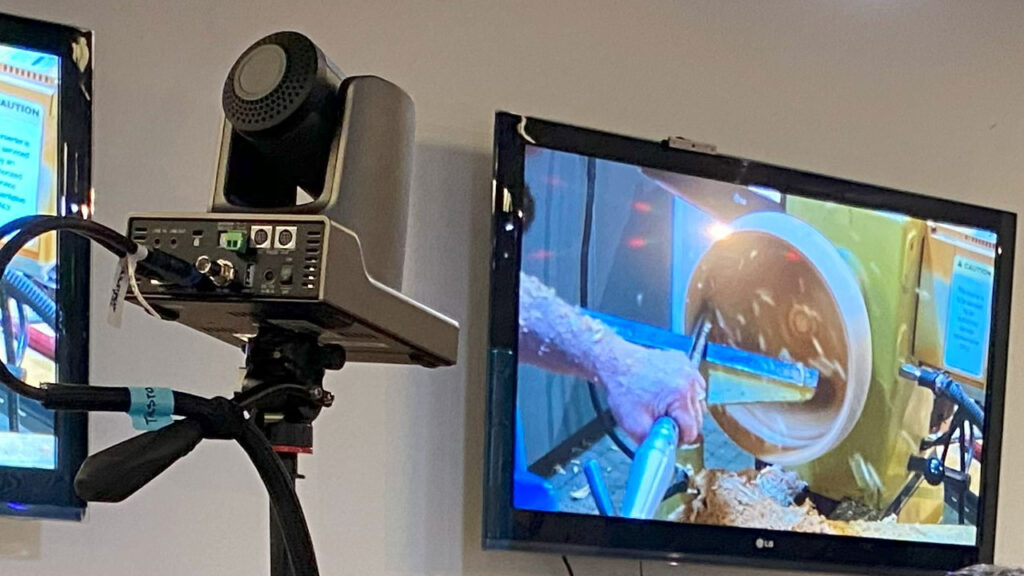 High quality camera relays a woodturning demonstration to a wall monitor