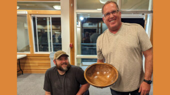 Dan Boehmke (right) shows his bowl. Nate Segraves is on the left.