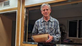 Tom Mandle shows his redwood bowl